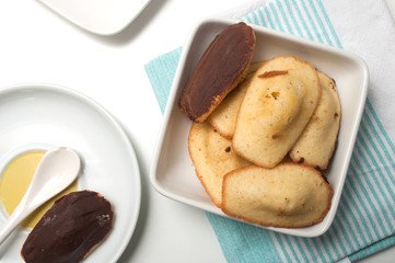Closeup of french chocolate madeleines on white background on top view