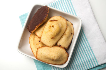 Closeup of french chocolate madeleines on white background on top view