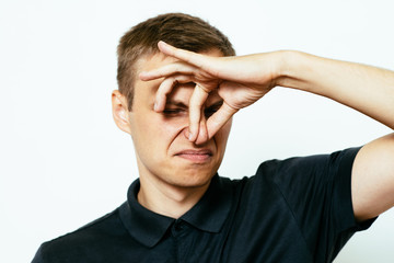 The stench. Closes the man's nose