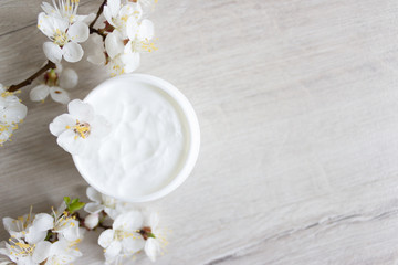 Fototapeta na wymiar Natural cosmetics for hand skin care, cherry blossom