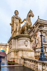 Fototapeta na wymiar Rome, Italy. Equestrian statue of Pollux at the Cordonata Stairs at Piazza del Campidoglio (Capitol Square) on Capitoline Hill, the most important of Rome's seven (7) famous hills.