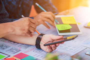 Soft Focus and Blur,A group of web designers are working together to develop a mobile responsive website with UI UX Front End Designer Previewing. Website development concept UI UX front end designer 