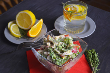 Salad with radishes, lettuce and cherry tomatoes seasoned with diet yogurt. Vitamin spring salad of fresh vegetables. Top view and side view.