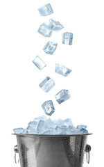 Ice cubes falling into bucket on white background © New Africa