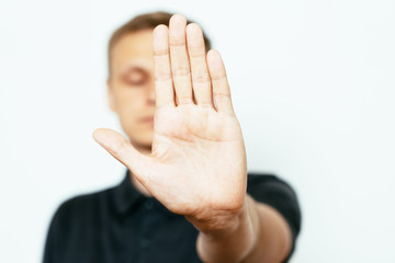 Businessman shows stop gesture