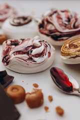 Meringue. sweet meringue. Tray of meringues. Closeup meringue photo. Dessert background. Sweets. Food. Flat lay and copy space. Top view