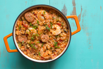 Top view of jambalaya with shrimp and andouille sausage. Copy space. 