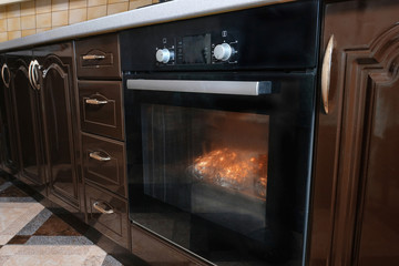 Using an electric oven for baking and cooking.