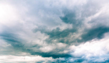 Naklejka na ściany i meble Blue sky with clouds before a thunderstorm.Sky background.Panorama