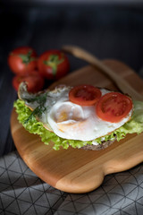 Fried eggs for breakfast with tomatoes