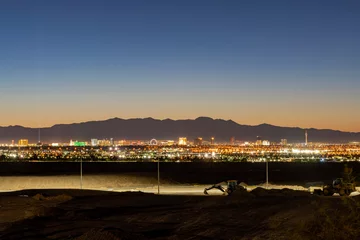 Fototapete Rund Dusk high angle view of the skyline of Las Vegas with Excavator below © Kit Leong