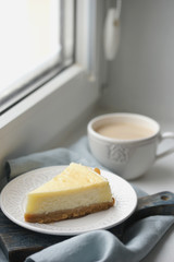 Serving of cheesecake on a white saucer