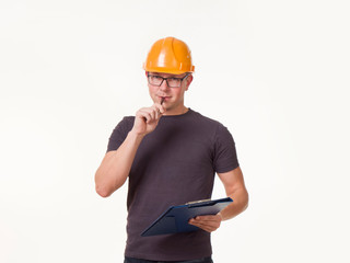 young man - worker in a helmet with a folder