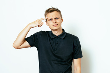 Closeup portrait of angry man gesturing with his finger against his temple, are you crazy?