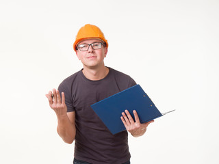 young man - worker in a helmet with a folder