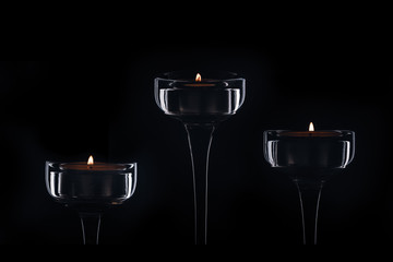 three wine glasses in the dark