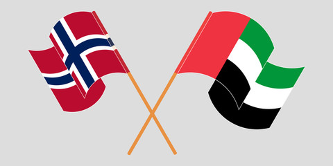 Crossed and waving flags of Norway and the United Arab Emirates
