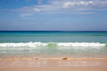 Ocean waves rolling in on a Phi Phi island beach in Thailand.