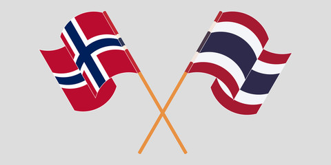 Crossed and waving flags of Norway and Thailand