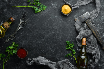 Black stone food background. Cooking. Top view. Free space for your text.