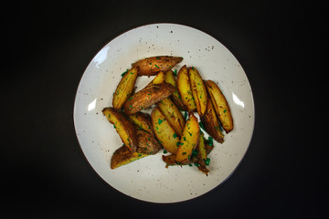tasty food on a black background, dark background dishes of different countries, plates salads meat