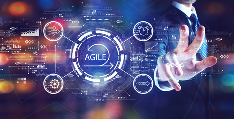 Obraz premium Agile concept with businessman on night city background