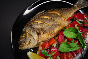 tasty food on a black background, dark background dishes of different countries, plates salads meat