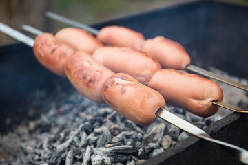 sausages fried on fire
