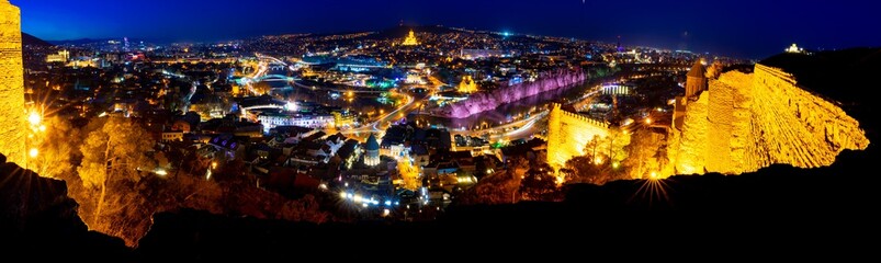 wide angle background image of  tbilisi panorama from Narikala fortress at night.Historical sites  in Georgia. Blank space. 2020