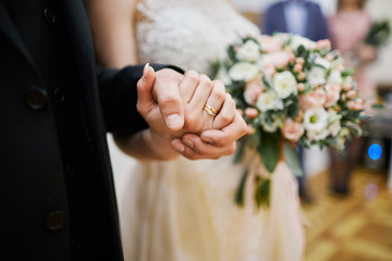 people in love holding each other's hands