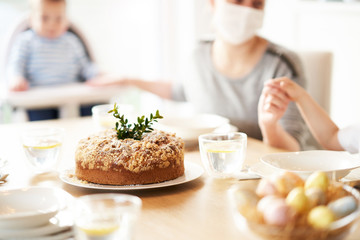 Family at home quarantine over Easter table