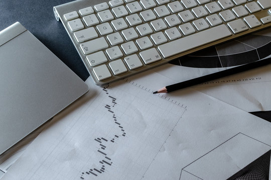 Finance background. Charts graphs diagram in office. Financial analytics reviewing documents. Concept image of data gathering and statistical working.