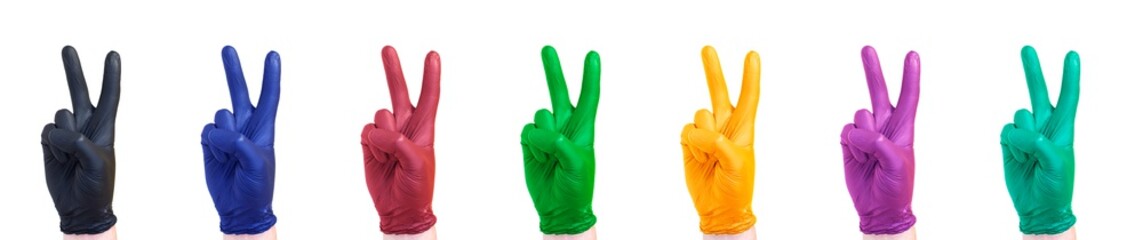 A hands in medical or cleaning gloves making a victory gesture isolated on white background. A set if black, blue, red, green, orange, violet and mint colors.The victory of medicine concept.