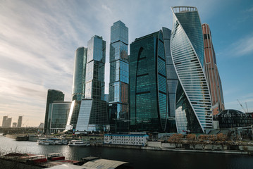 Fototapeta na wymiar Moscow skyscrapers on the river bank