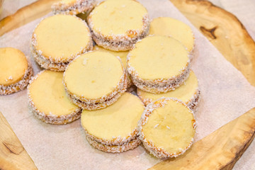 Presentation of handmade cookies on a wooden board.