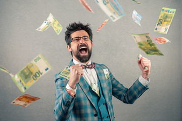 Happy business man with glasses and money flying