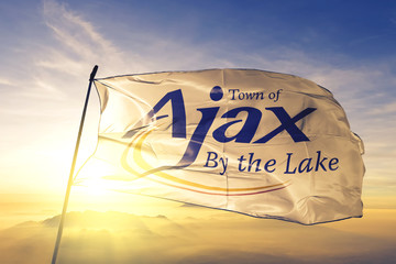 Ajax of Ontario of Canada flag waving on the top sunrise mist fog