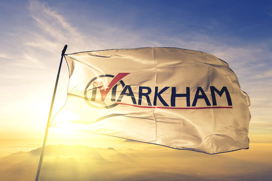 Markham of Ontario of Canada flag waving on the top sunrise mist fog