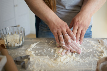 women's and men's hands mix wheat flour. baker's hand closeup.couple together Cooking pizza, bread