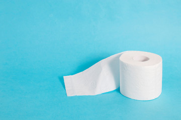 Roll of toilet paper on a blue background.