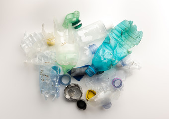 Heap of plastic garbage isolated on white background
