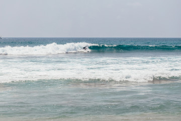 Surfer on the ocean waves.