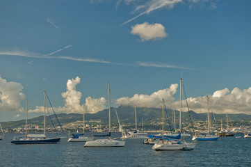 Fototapeta na wymiar Distant Caribbean Islands and docked boats