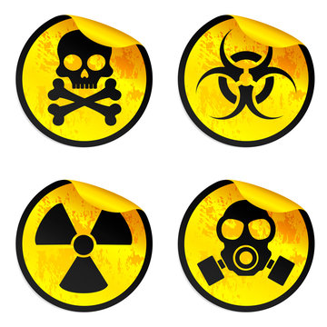 Danger yellow stickers set. Radiation warning sign, biohazard warning sign, gas mask warning sign, toxic warning sign. Vector illustration
