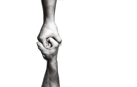 Helping hand concept and international day of peace, support. Helping hand outstretched, isolated arm, salvation. Close up help hand. Two hands, helping arm of a friend, teamwork. Black and white