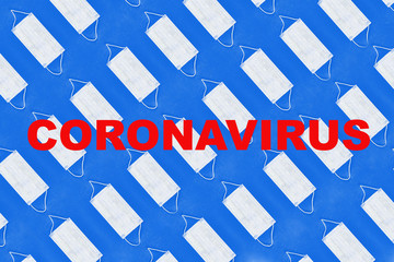 Pattern of face medical masks on dark blue background with text covid-19. Protection from coronavirus. Top view. Flat lay.