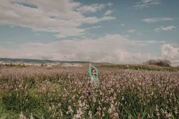 girl in a field with wildflowers 