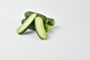 Fresh green cucumbers isolated on a white background