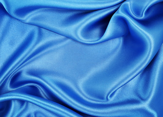 Obraz premium Smooth elegant blue silk or satin luxury cloth texture as abstract background. Luxurious background design