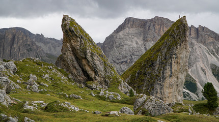 Distinctive rock formation in South Tyrol - Climber on Top of Pieralongia Rock